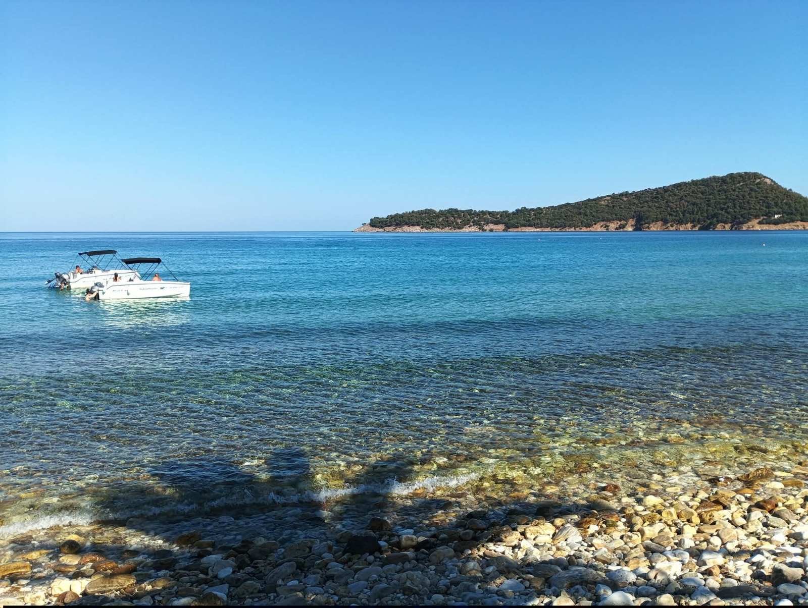 Boats anchored off the coast near Kinira