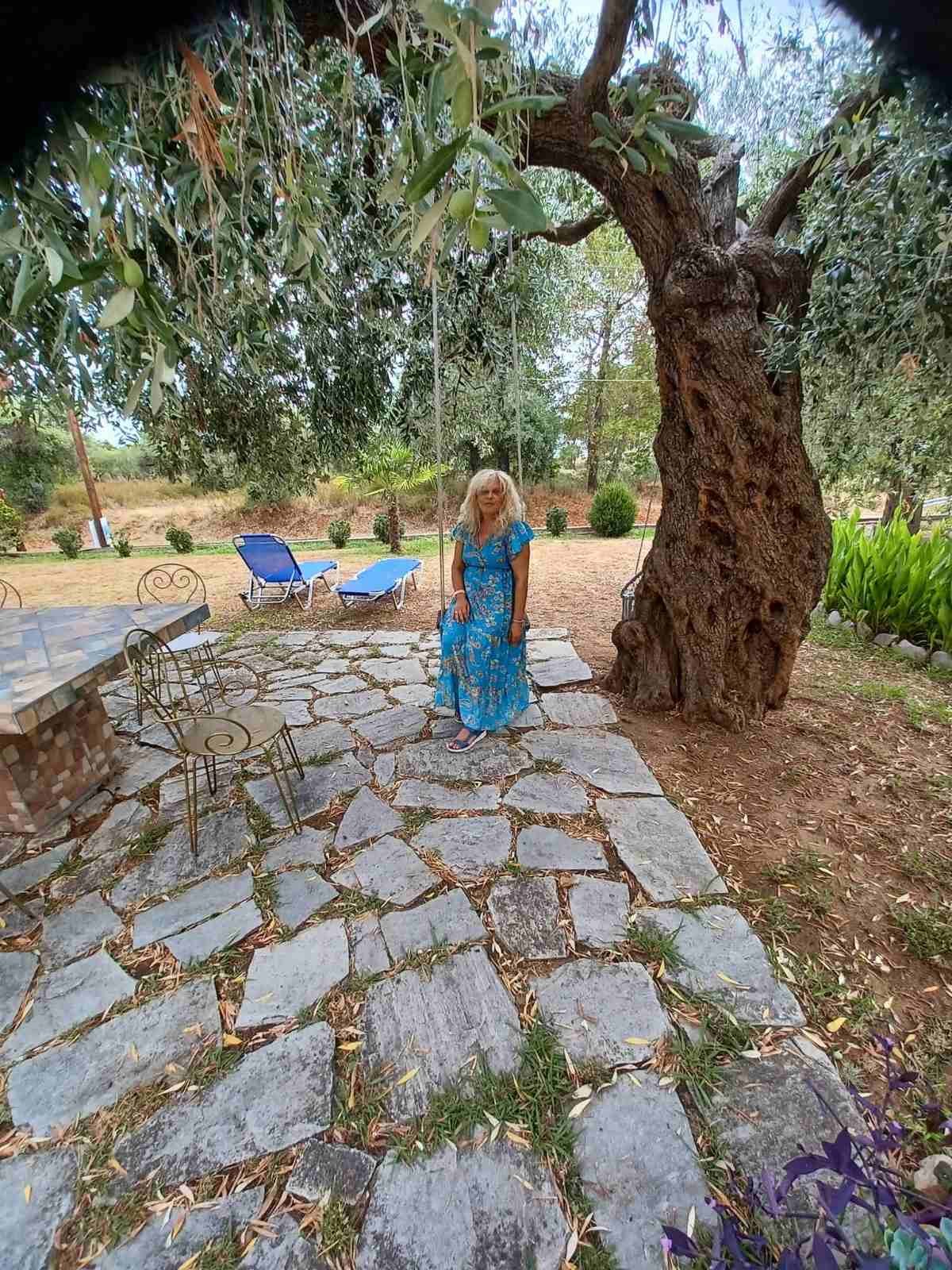 Marina in the garden beneath the old olive tree at Studios Betty